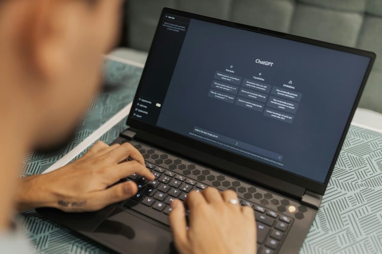 A man using ChatGPT on his laptop