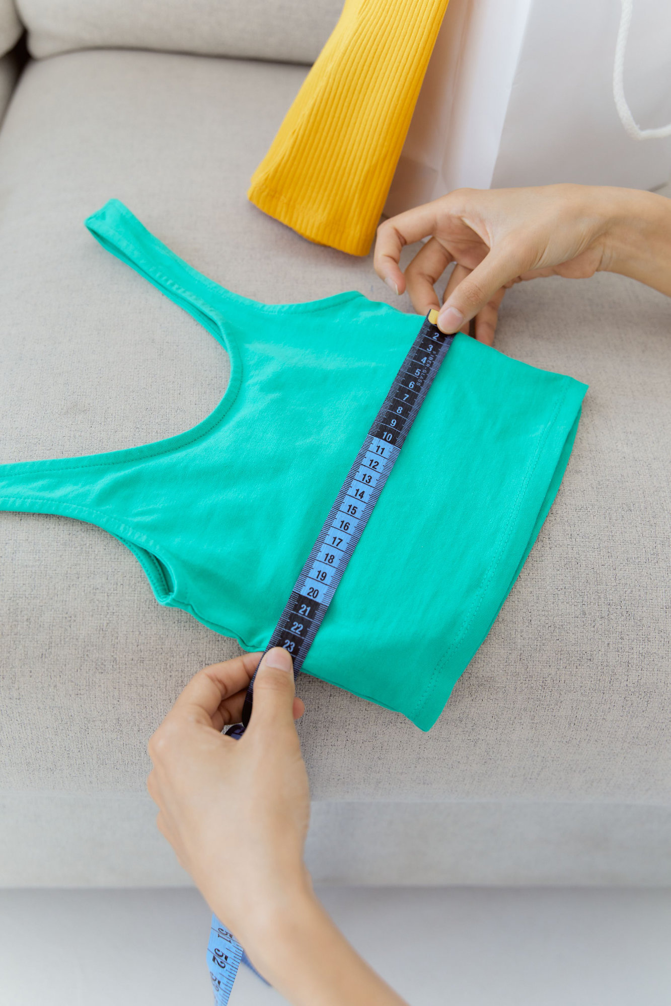 Someone measuring the size of a vest