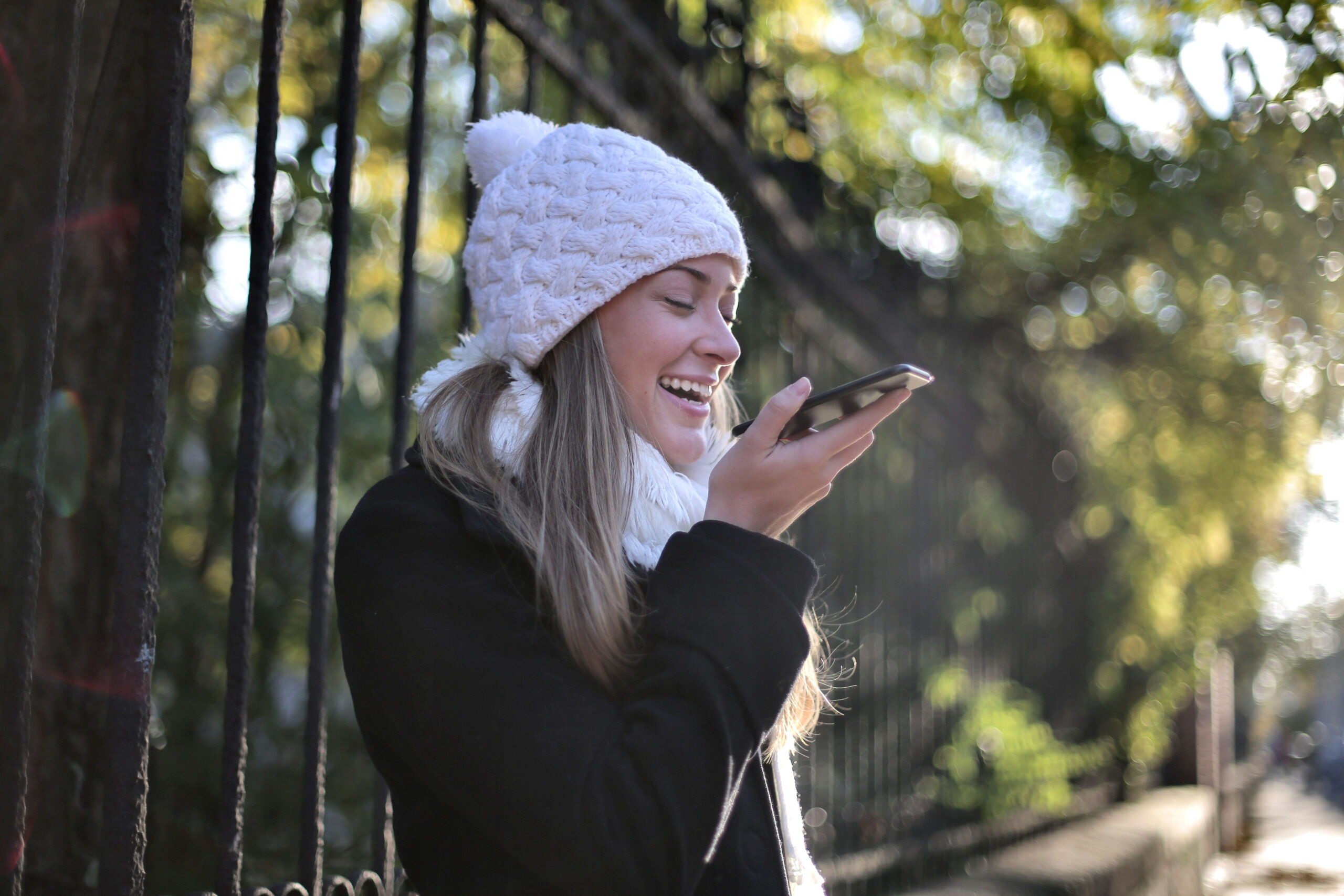 An image of someone using voice search on their phone